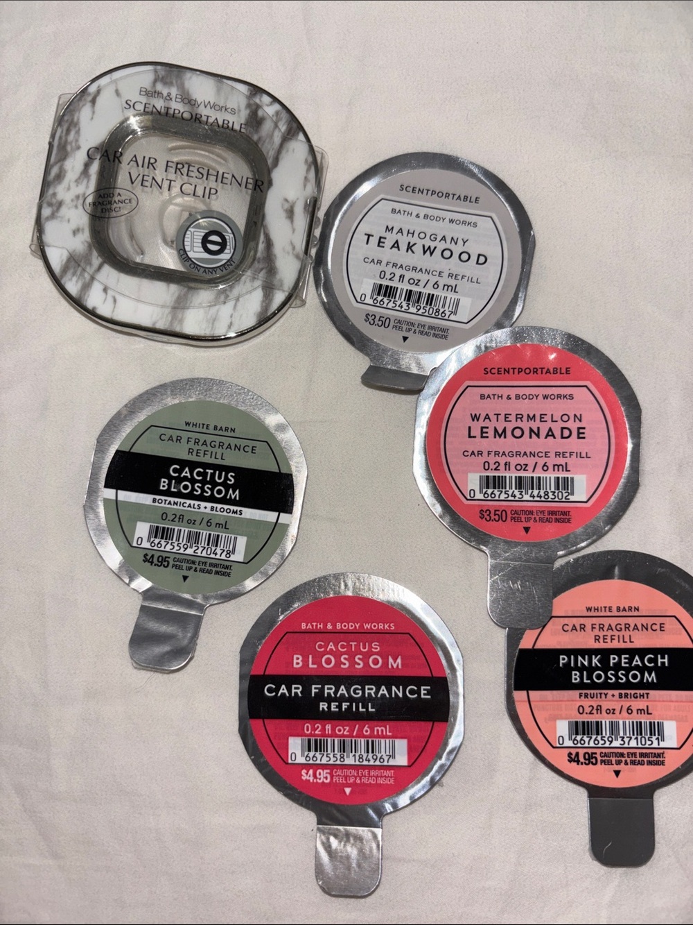 Bath & Body Works car air freshener and 5 scent refills